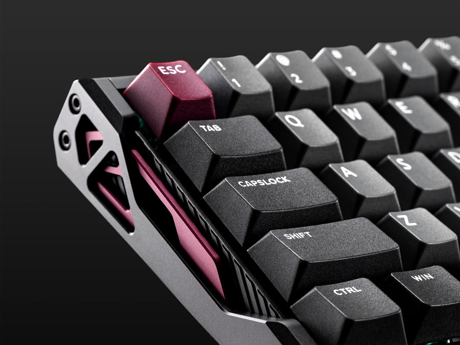IQUNIX EV63 aluminum side cutout IQUNIX EV63 left corner showing the race-inspired aluminum side cutouts and red Esc keycap