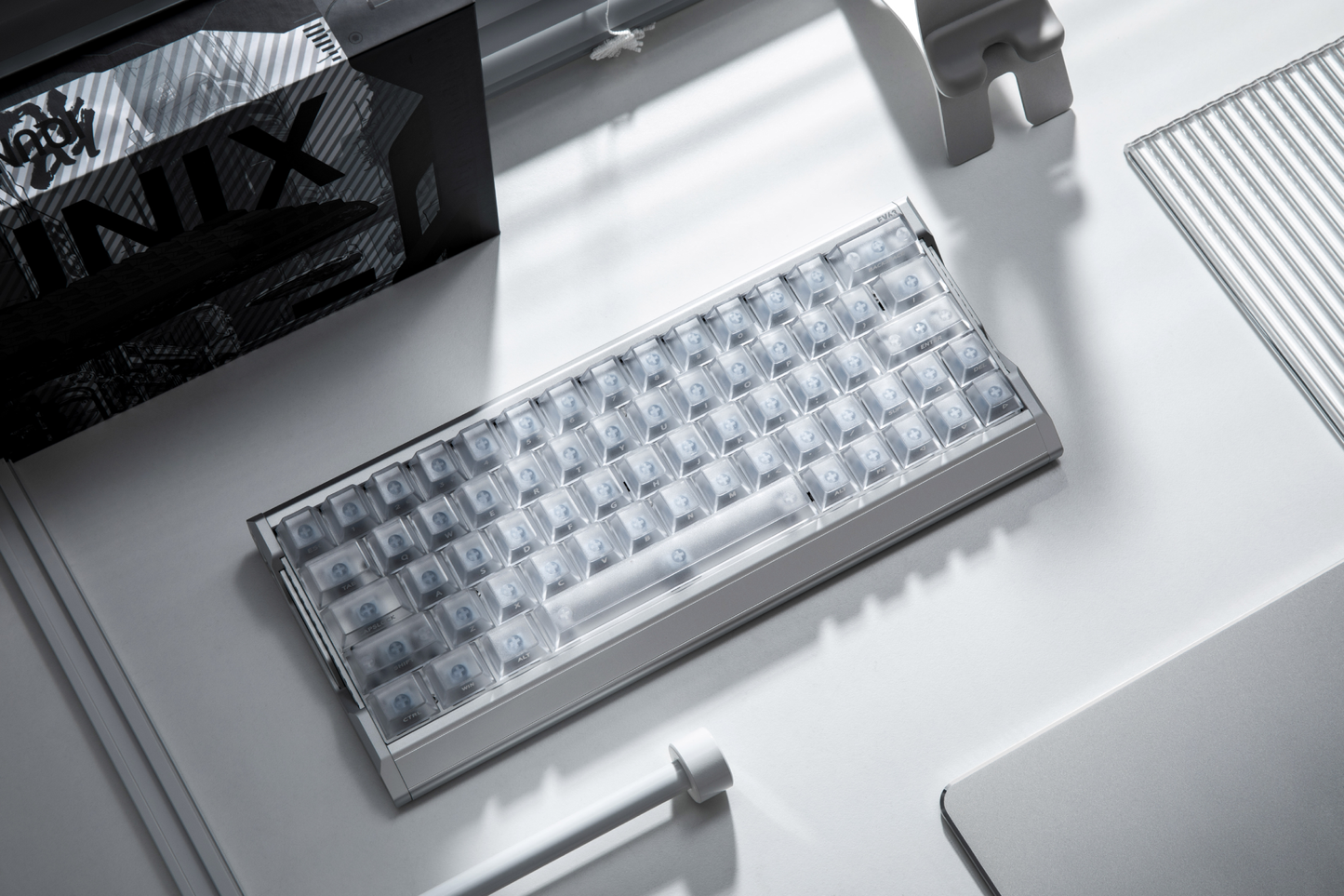 IQUNIX EV63 Silver Blade RS on desk – top-down angled view with translucent keycaps