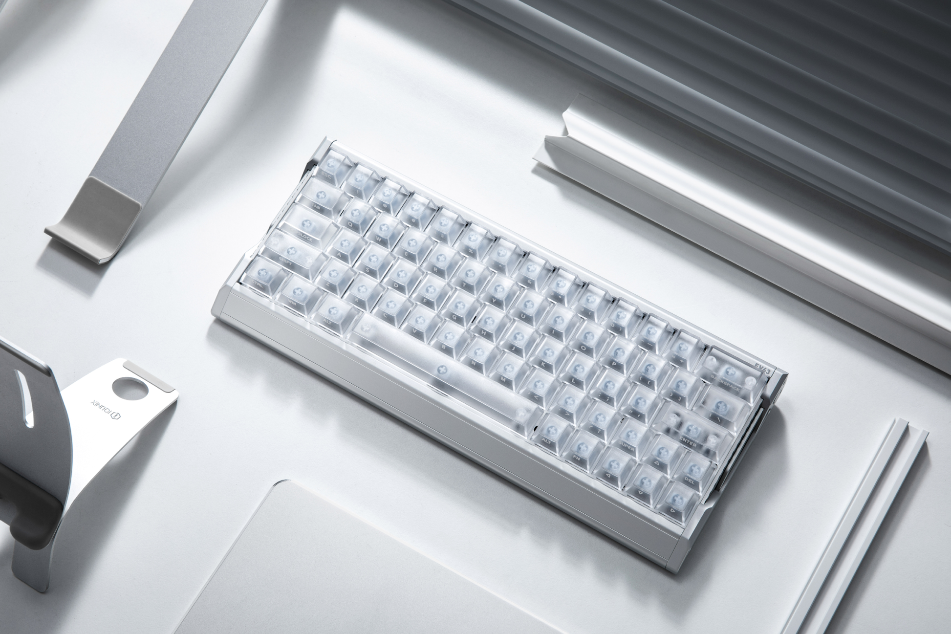 IQUNIX EV63 Silver Blade RS mechanical keyboard – minimal desk scene, translucent keycap set